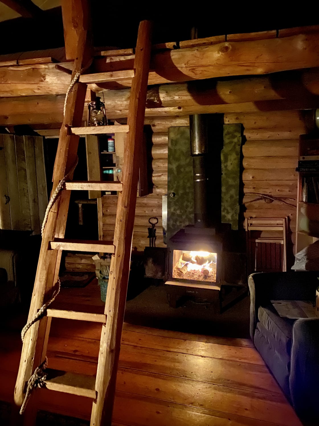 Woodstove and ladder to the loft