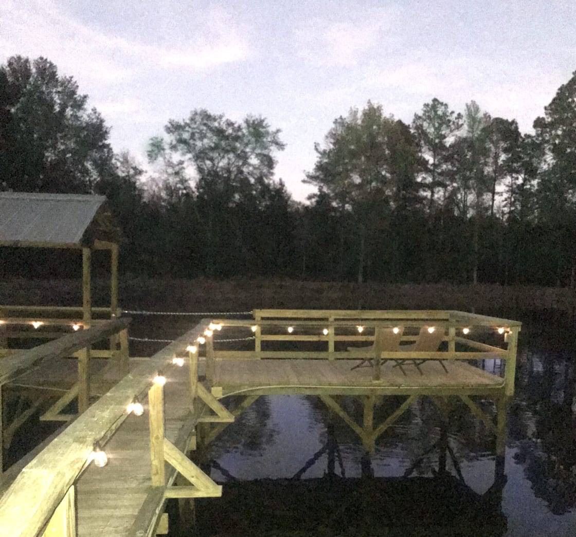 Night falls and the dock lights come on. 