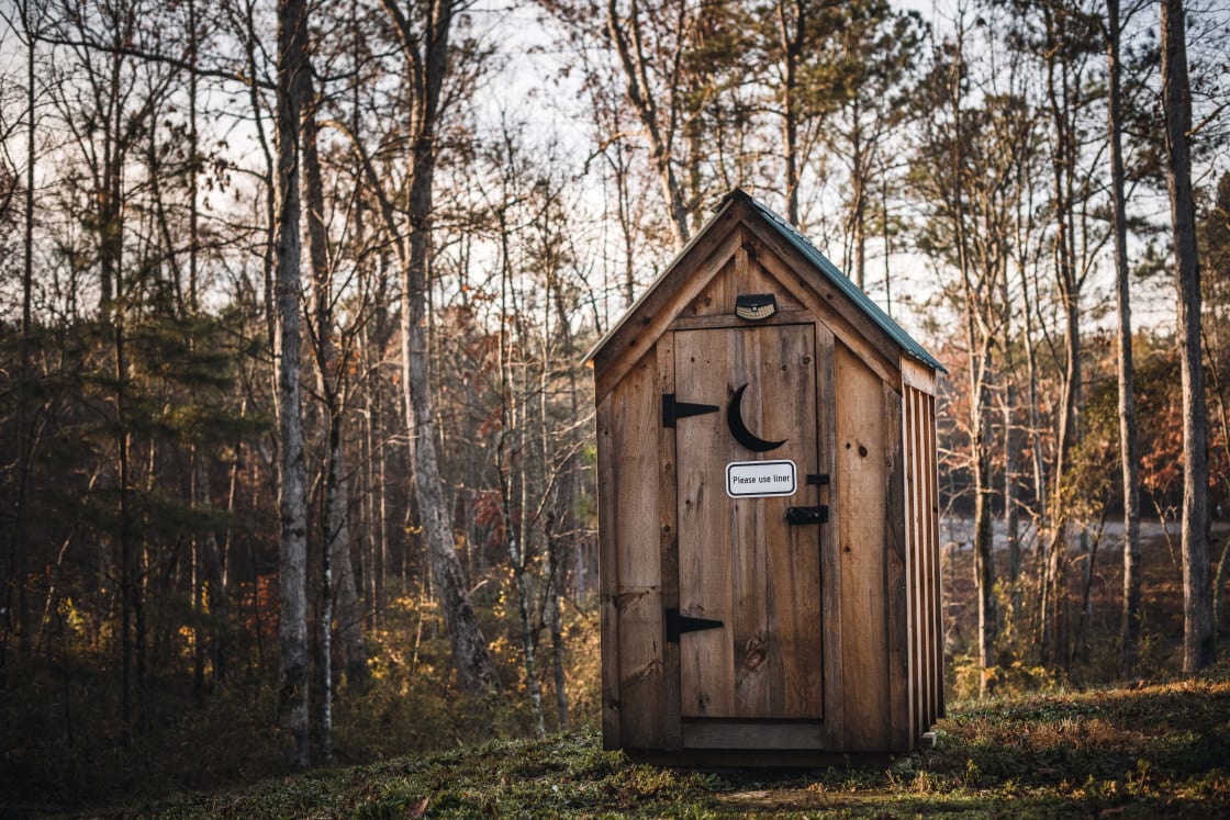 The outhouse is actually a super cool incinerator toilet! 