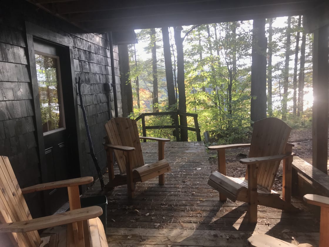 Lakeside deck with classic Adirondack chairs. Lovely sunset views here, and a great place to enjoy your morning coffee or tea. 