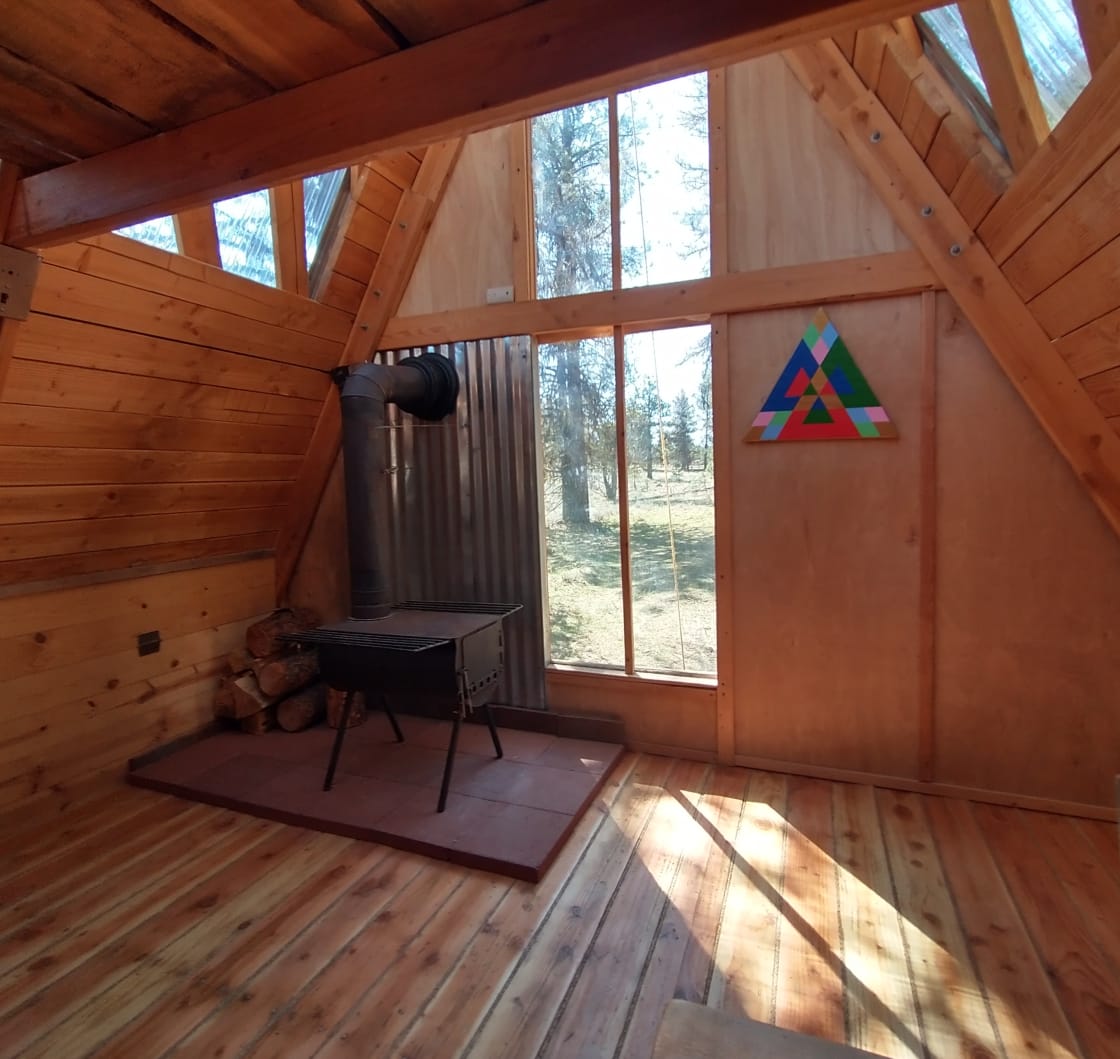 The footprint of the Snug Shack is 120 square feet. There is enough room downstairs on the floor for an air mattress or camping mat, or a roll-away folding bed is available for an additional rental fee. 