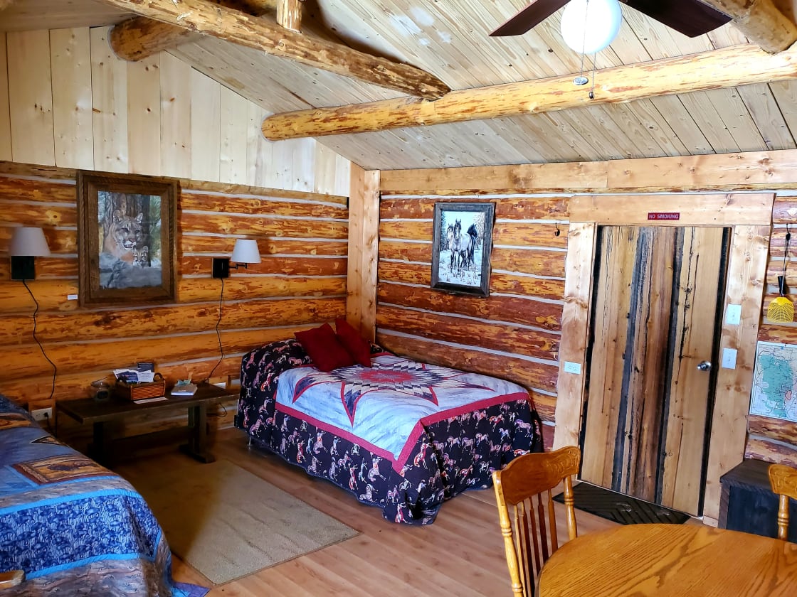The inside of this camping log cabin with 2 double beds