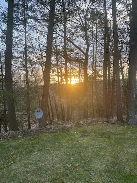 Sun rising over the Shawangunk mountains while looking out kitchen window at 6:48 AM