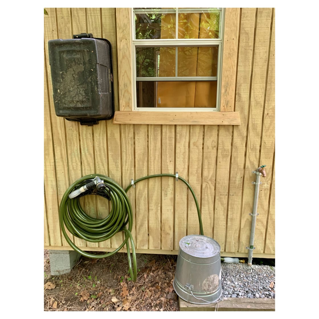 Spigot w/ potable water, a hose for rinsing off or putting fires out, and a wash bin is provided.