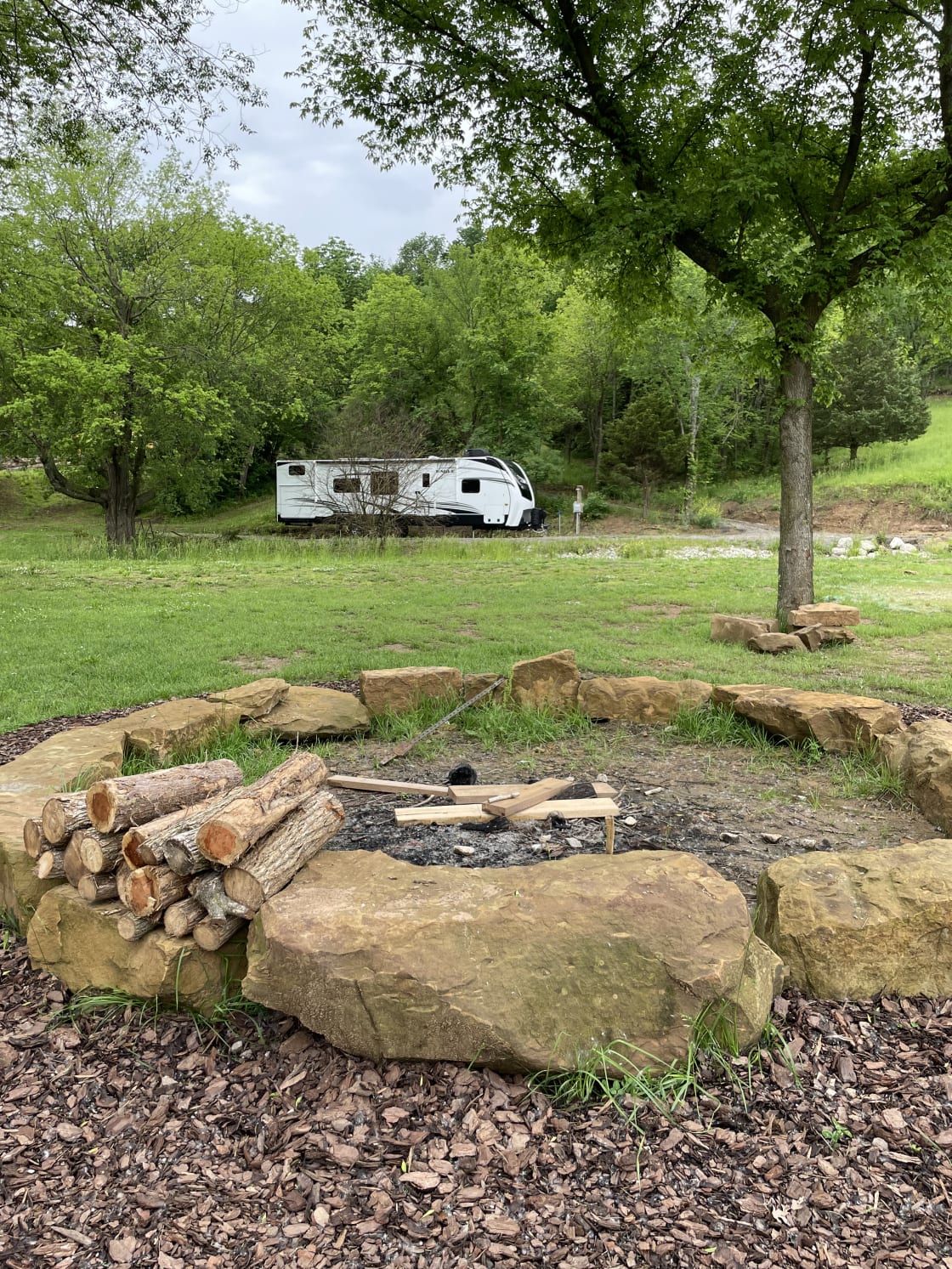 Southern facing view from fire pit. 

(Our personal RV pictured, so you can see how an RV looks in the space.)