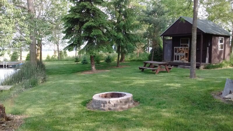 Fire ring and picnic area.  Firewood bundles (6 pieces) available on cabin porch, $4.