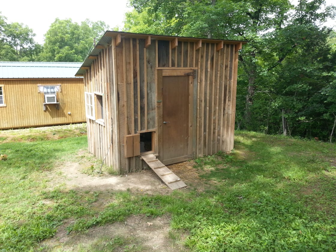 Poultry house crafted with reclaimed lumber from other salvaged buildings on the property