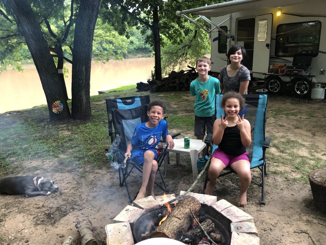 Kids hanging out at firepit ready for smores!