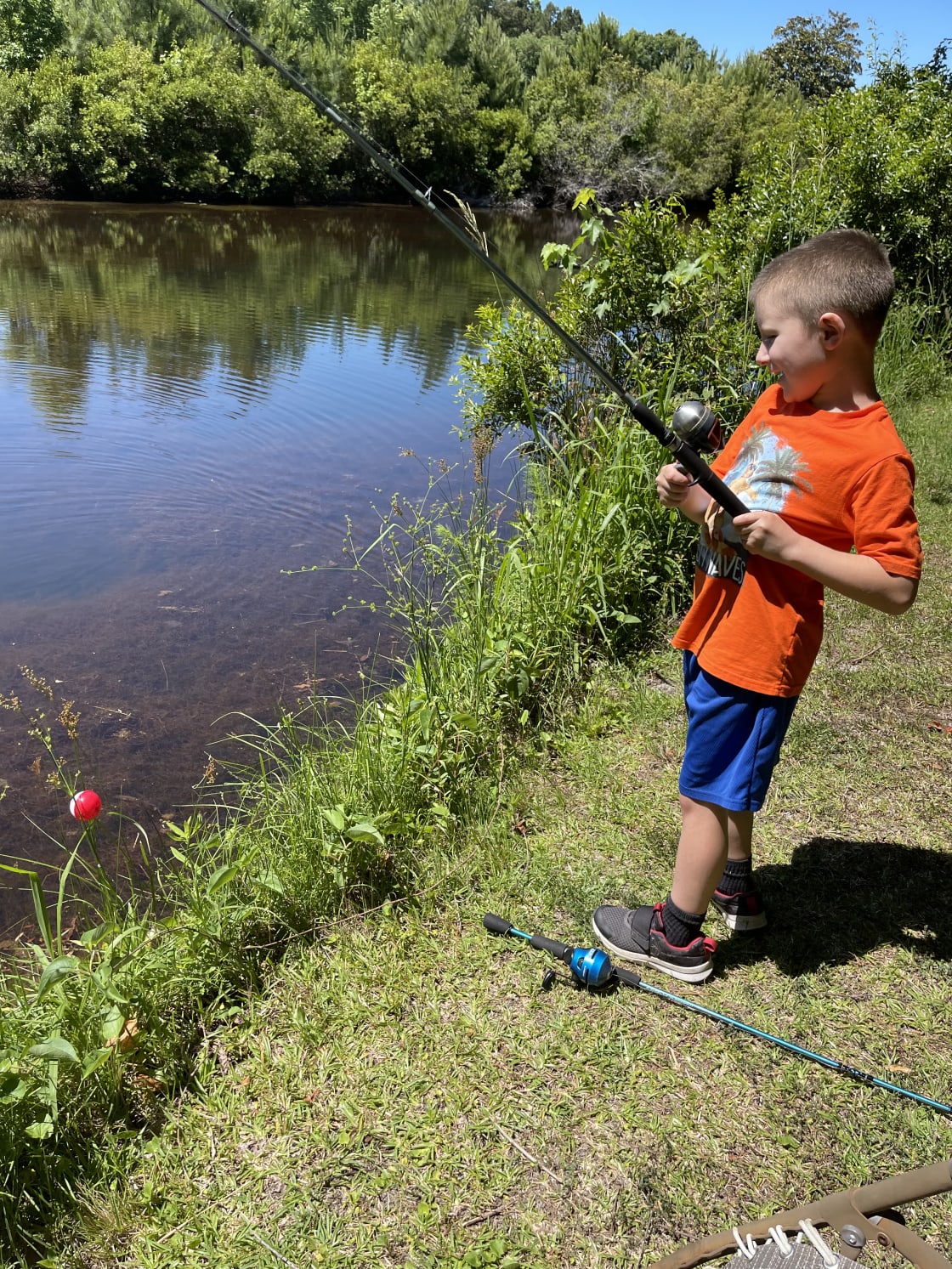 My son fishing in the pond. 