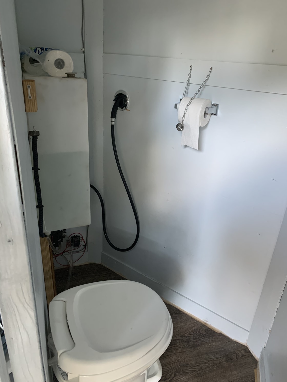 Bathroom in trailer.  Shower is on the exterior of trailer.  14 gallons of water provided