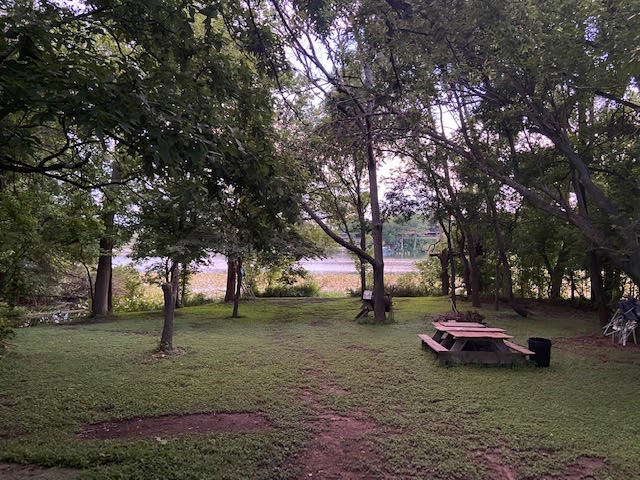 Community water area with grill ,fire pit,boat ramp and  table.