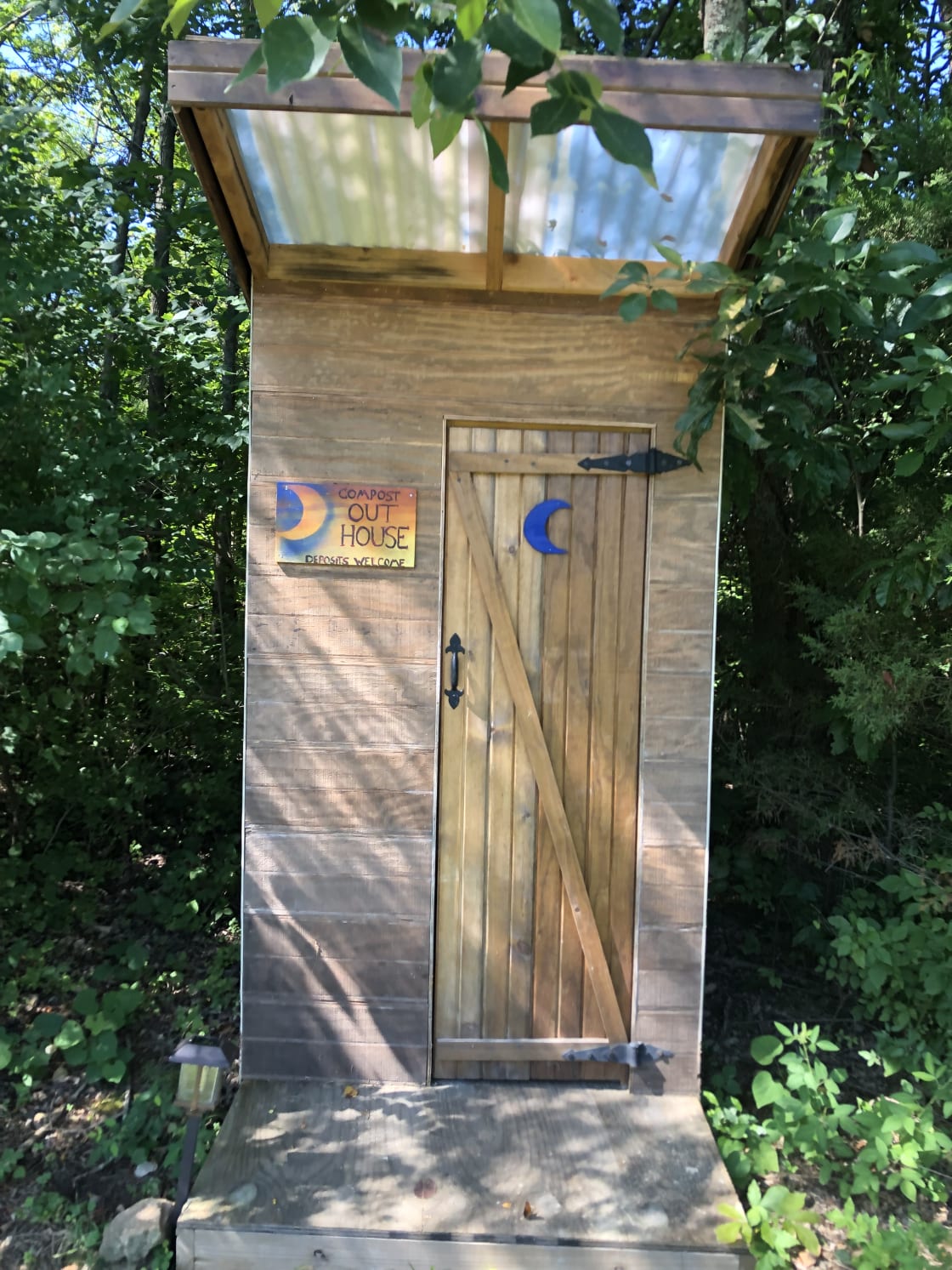 Amazing outhouse complete with lights and sawdust keeps it nice check it out!