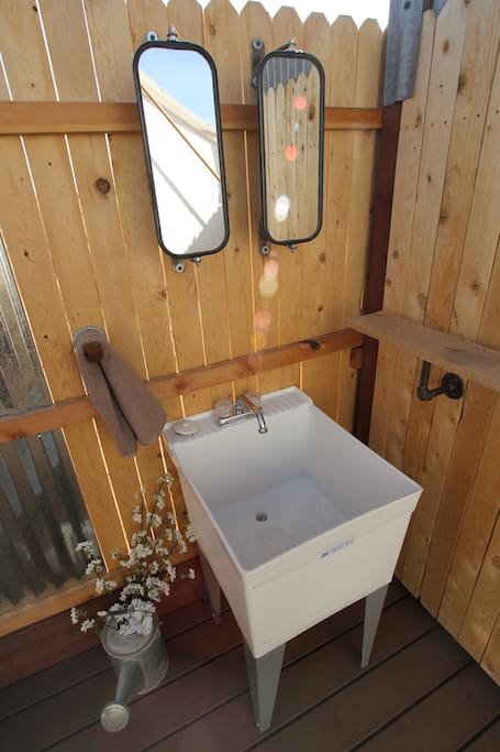 Details around each corner-  the bathroom mirrors are from a pickup truck! Due to freezing temps, the outdoor bathroom is available from May-September. Guests that book before/after these dates will have access to our indoor showers in our bathh
