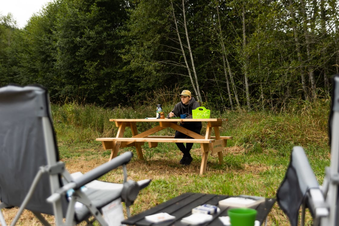 A sturdy picnic table at each site is perfect for eating, reading, and relaxing