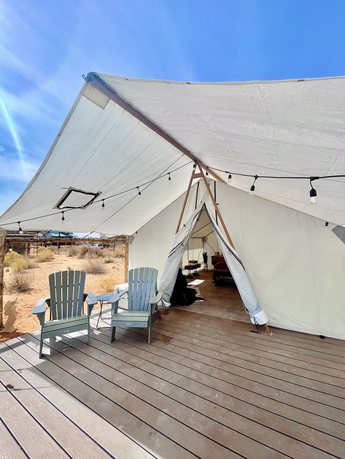 14X16 heavy duty canvas tent with concrete floors and a hardwood patio. Our tent is run on solar energy and has front porch lighting, indoor lighting and outlets.