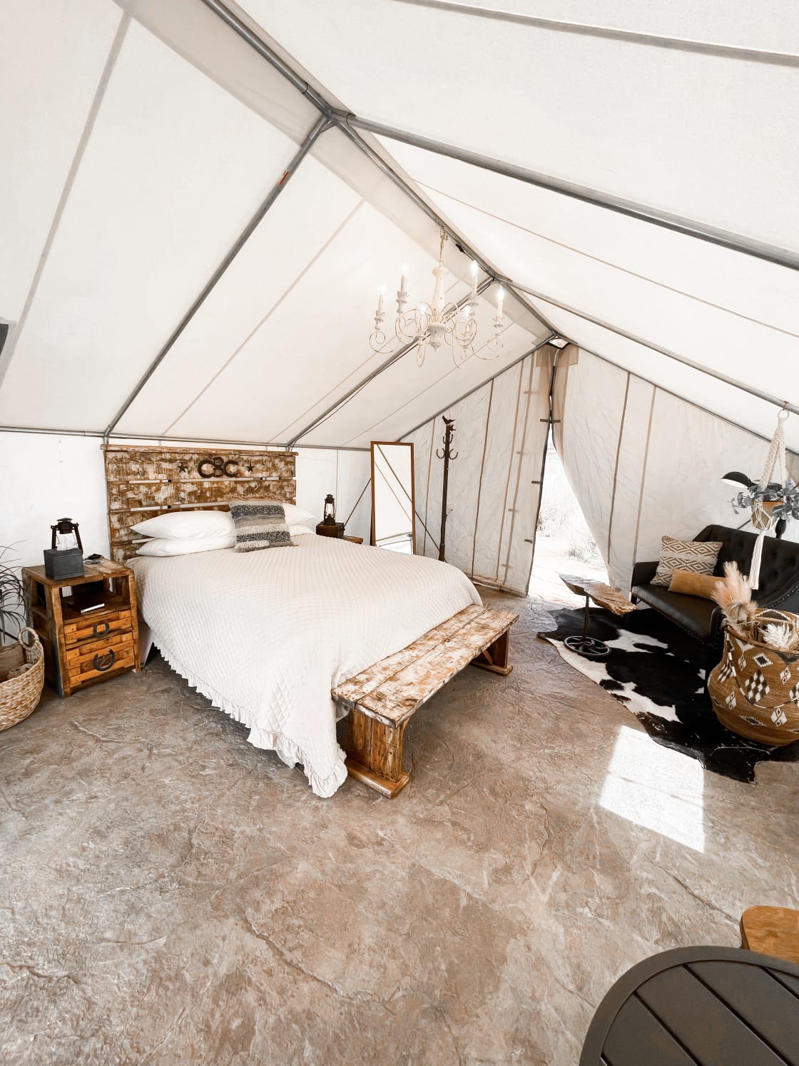 Welcome to your desert escape, Honeymoon Hideout. Handcrafted Western decor mixed with modern touches, there's no other tent like it. A/C and Heater provided.