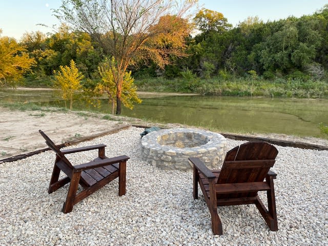 Rock seating area with adirondack chairs - Site 2