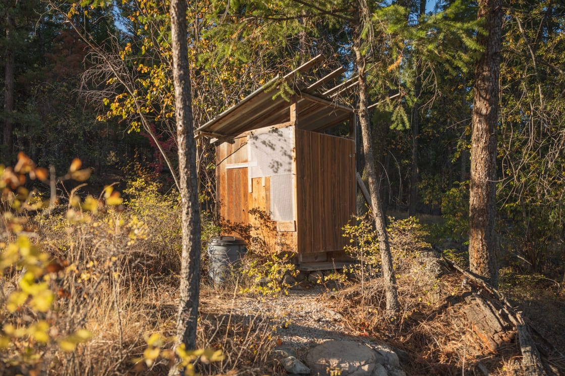 The outhouse is a short walk from the campsites. It's bright and clean, well-stocked, and has a great view of the surrounding forest.