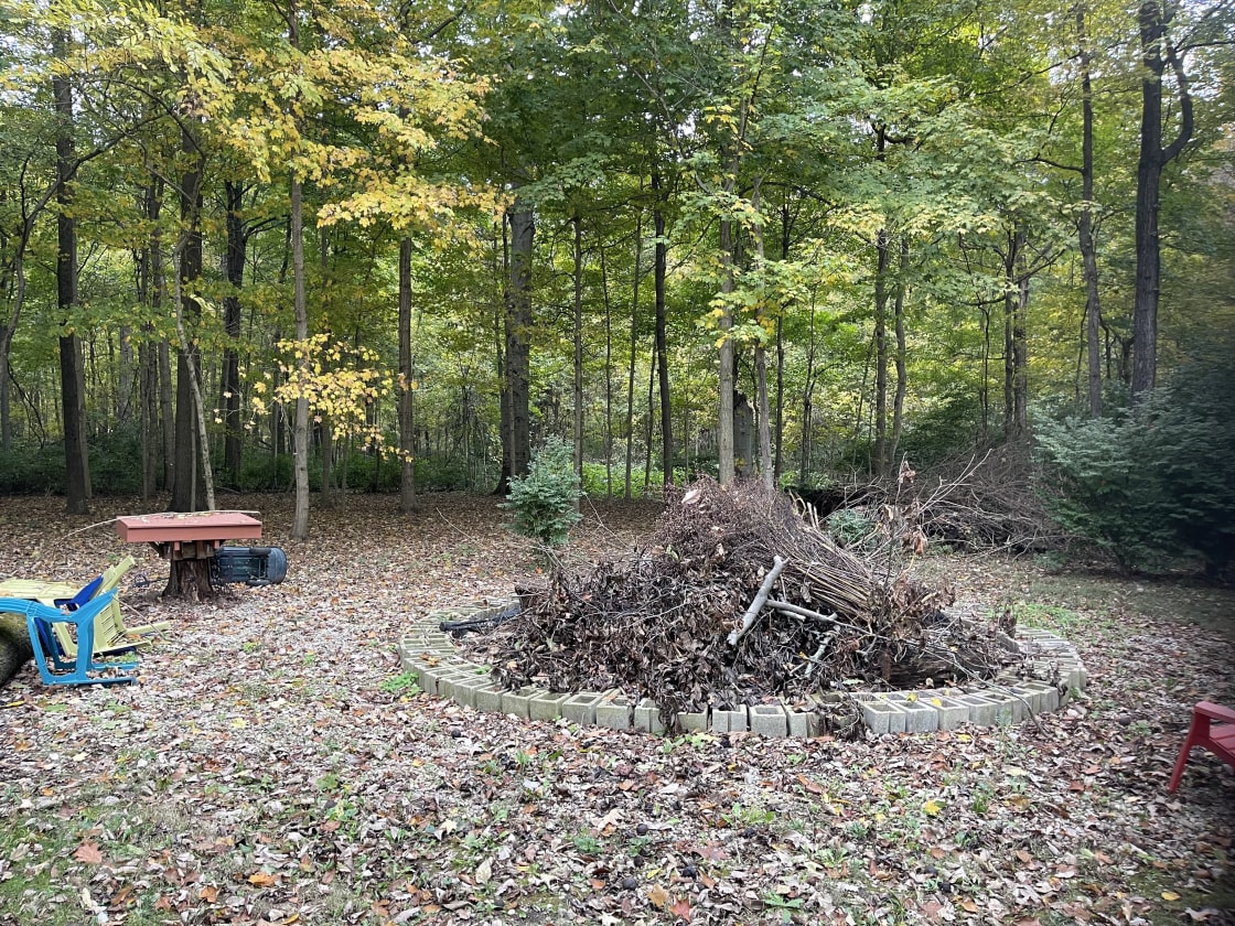 Bonfire pit with open camping behind 5-7 tents