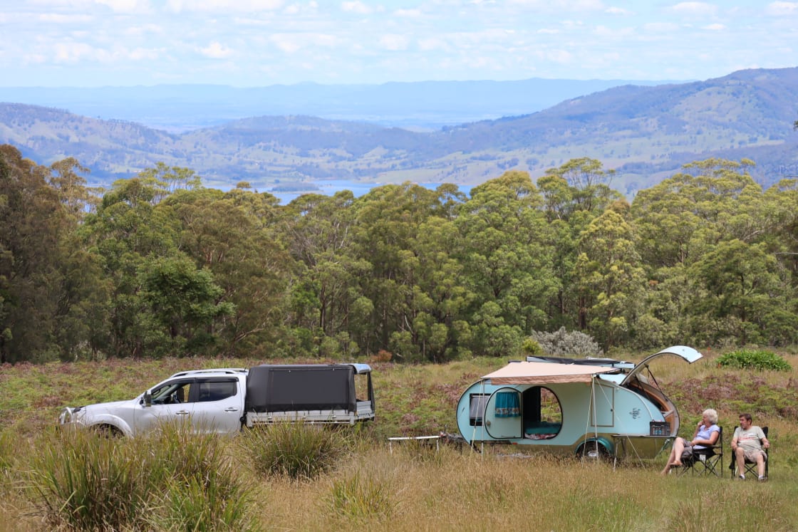 Your mountainside camping spot with the view over Lake St Clair and the Hunter Valley beyond
