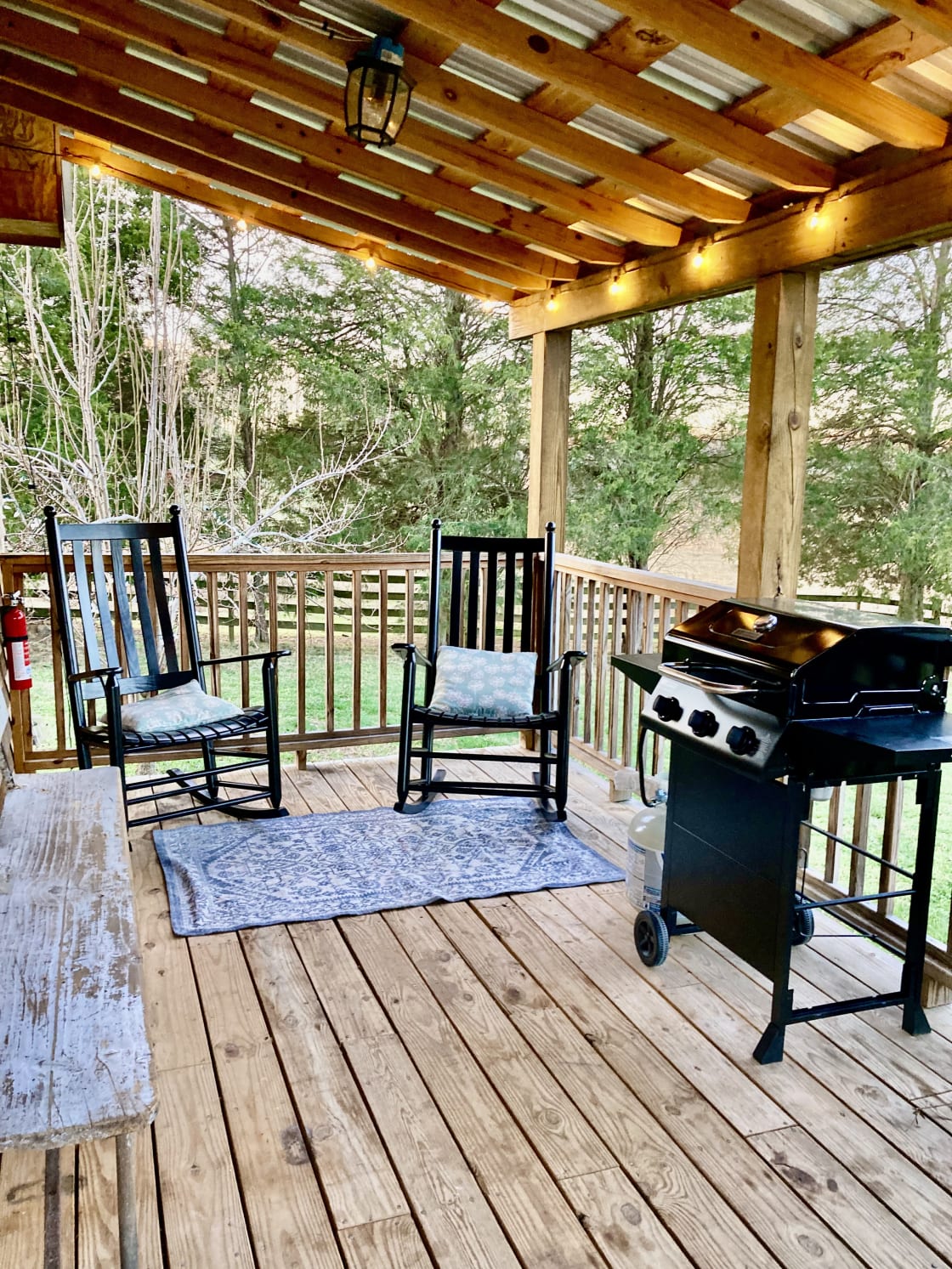 The 2 locally made Troutman Rockers and the new Gas Grill on the back porch allows for modern convinces with the outdoor experiences. 