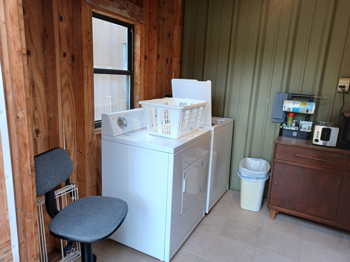 Full size washer and dryer, drying rack for delicates.  Starter detergent and dryer sheets in the laundry basket.  Dryer has wool balls in it to increase efficiency and decrease wrinkles and static.