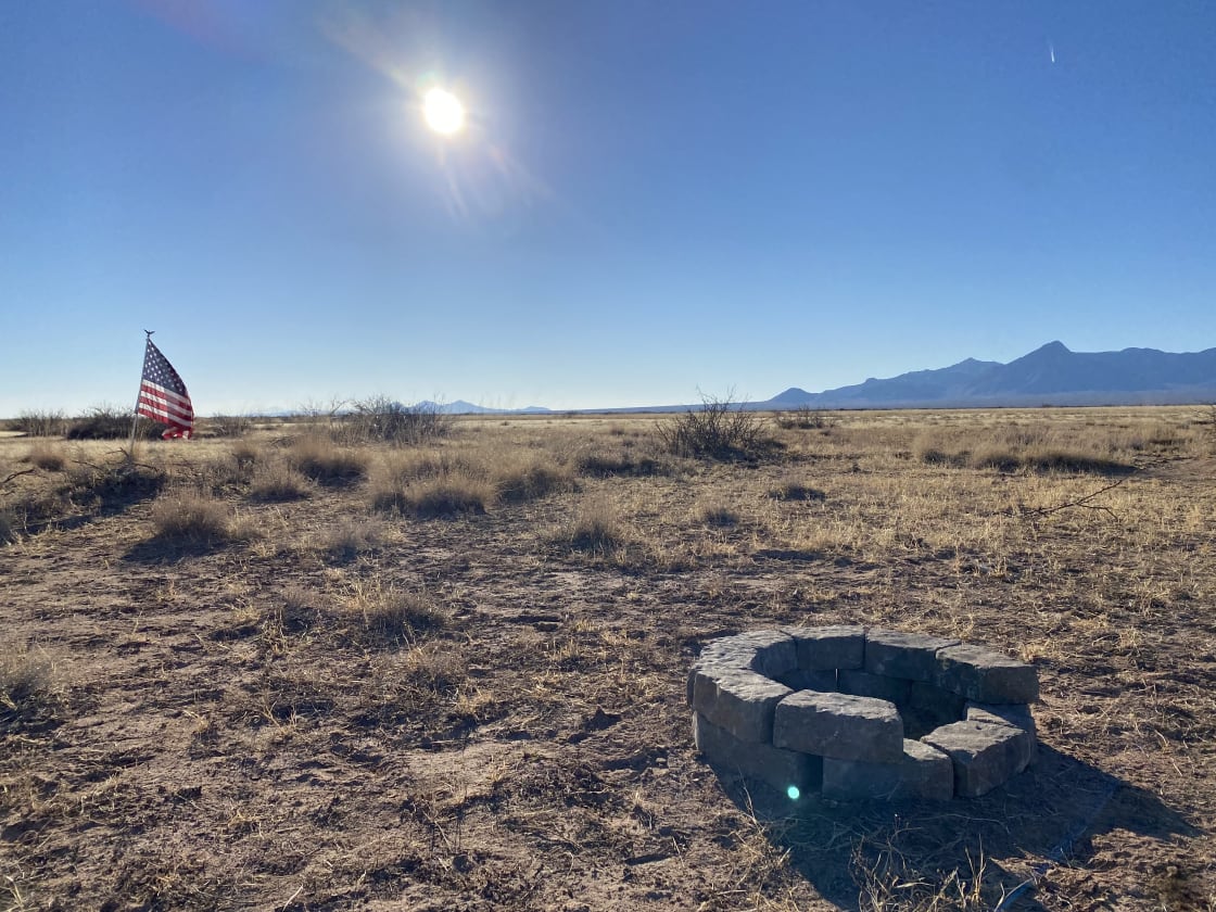 A flag, a fire pit and the Florida mountains in the background!