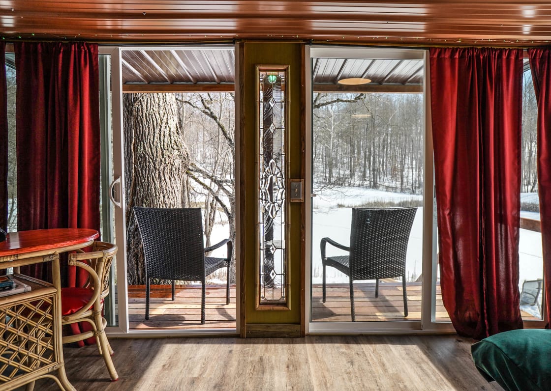 Go through the sliding glass doors out to the back porch for a nice view overlooking the Pond