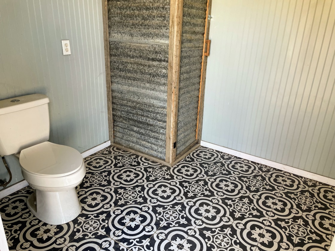Indoor plumbed shared bathroom