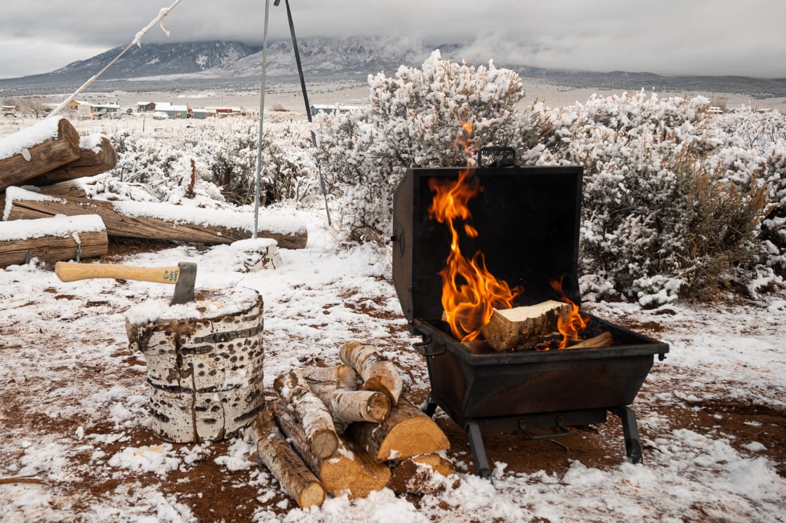 Campfires in the snow - does it get any better than that? The portable wood fire stove was provided at camp.