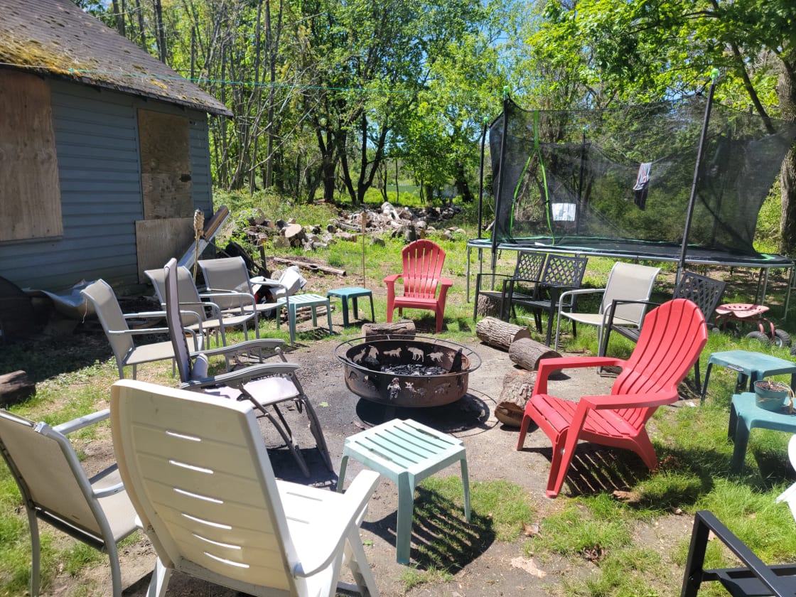 Fire pit, chairs and foot rest logs