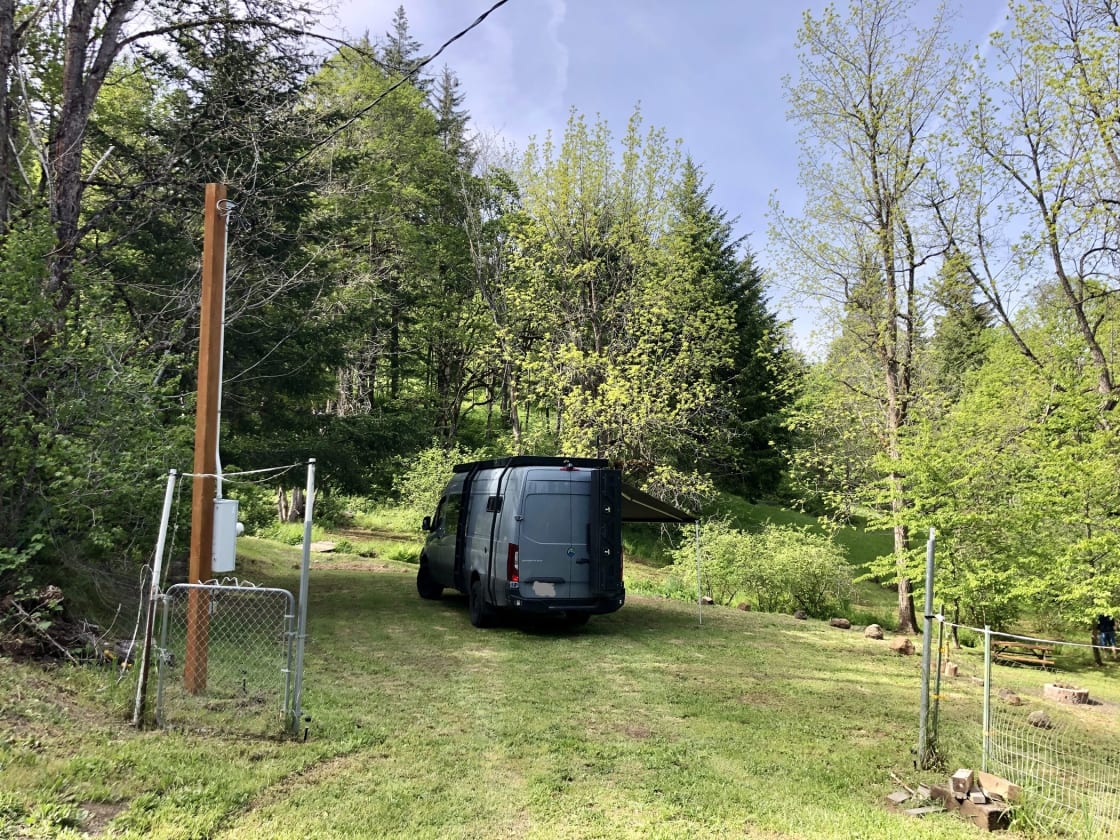 The entrance to the parking pad from the road. We recommend backing in to make it easier to get out, but this 27 foot sprinter van made a few quick turns and was able to back out.