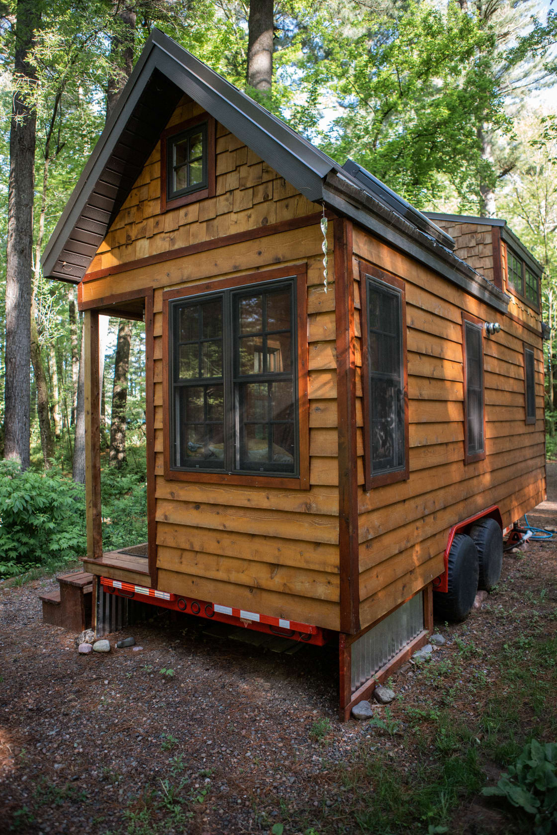 Here are a couple shots of the exterior of the tiny house! So cute!