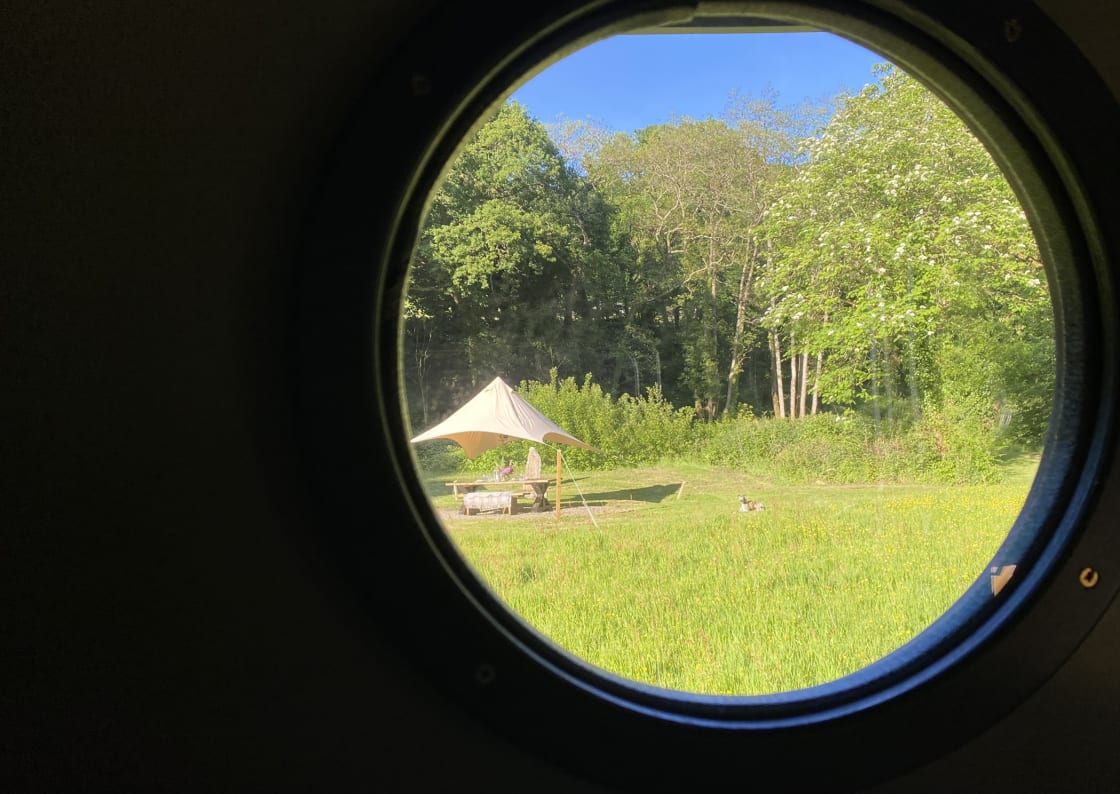 View of the table and canopy through the porthole