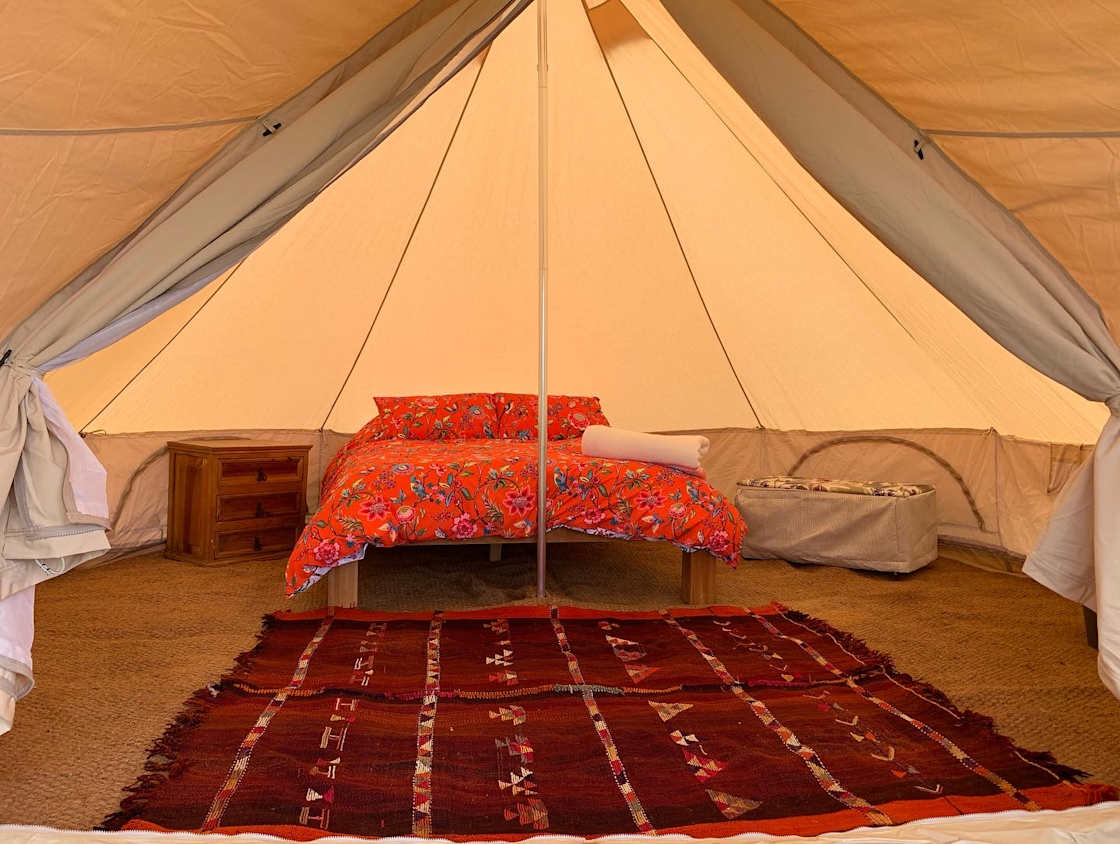 Inside one of our bell tents; king-size bed.
