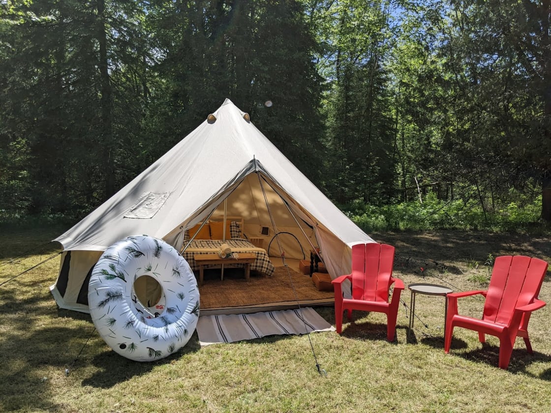 At your tent, enjoy your private fire pit, in these iconic Muskoka chairs.