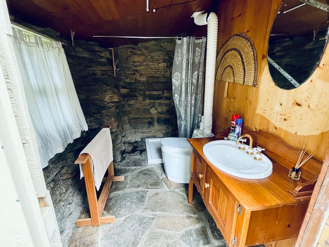 Round the other end of the cabin is the bathroom with a shower and a compost toilet.