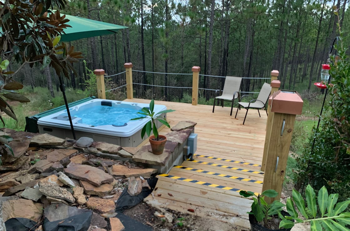 Hot tub with deck overlooking the Longleaf Pines