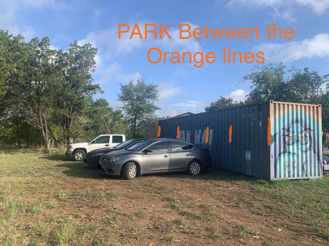 PARK ON THE LEFT SIDE OF THE OWL CONTAINER, BETWEEN THE ORANGE LINES.