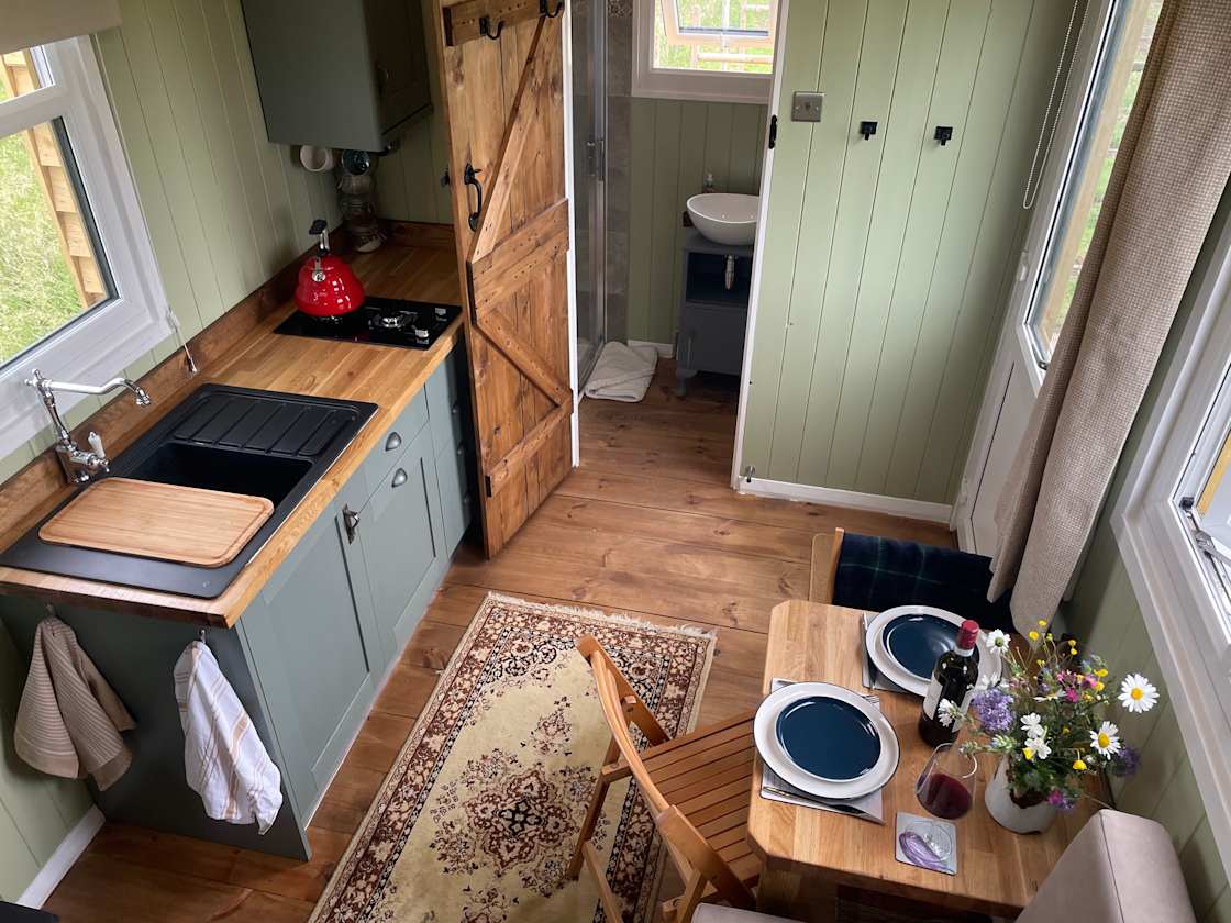 Full kitchen with hob, fridge/freezer and dining area
