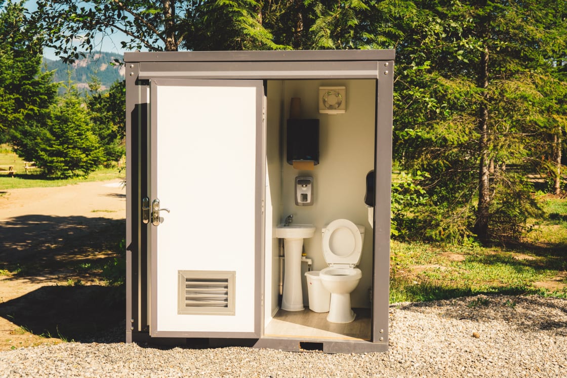 The flushable outhouse.