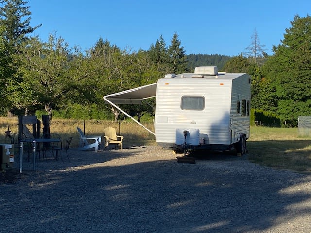 Example of Trailer positioning in the RV spot.  Feel free to park vehicle in grass next to Trailer or in gravel.  