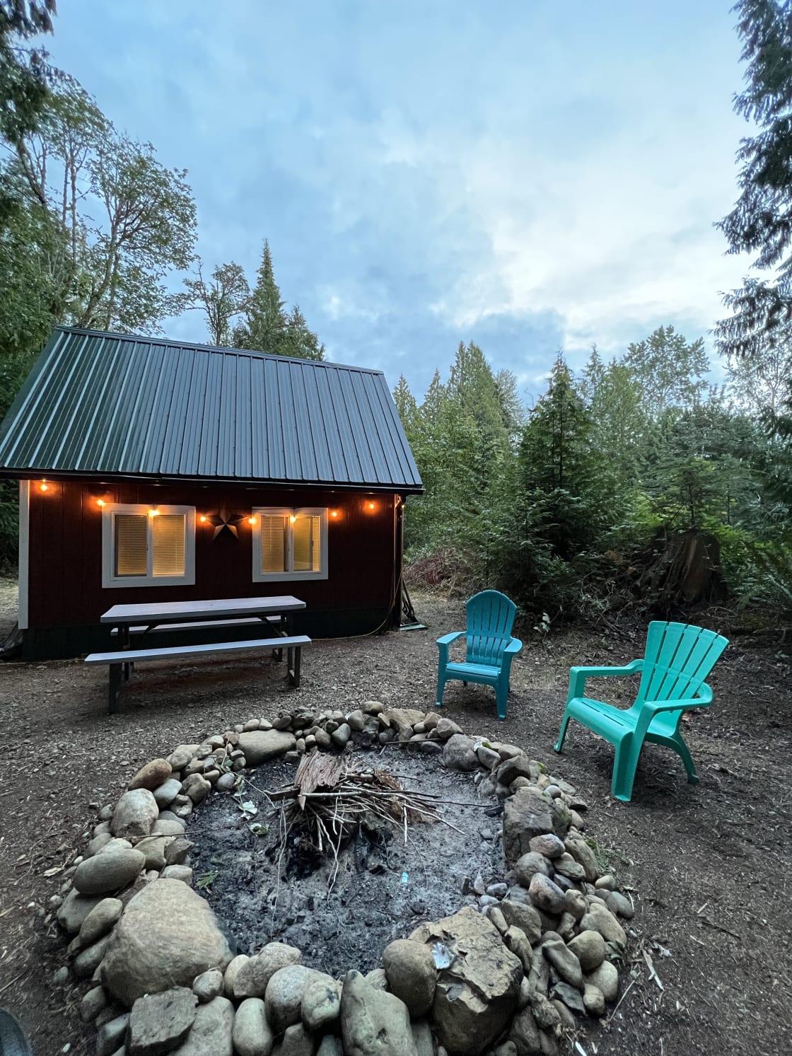 Enjoy an evening around the fire.  2 outside chairs and picnic table provided.