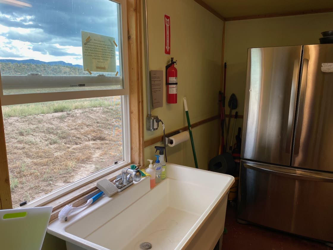 Dishwashing sink with a hot water and fridge/freezer for campers to use