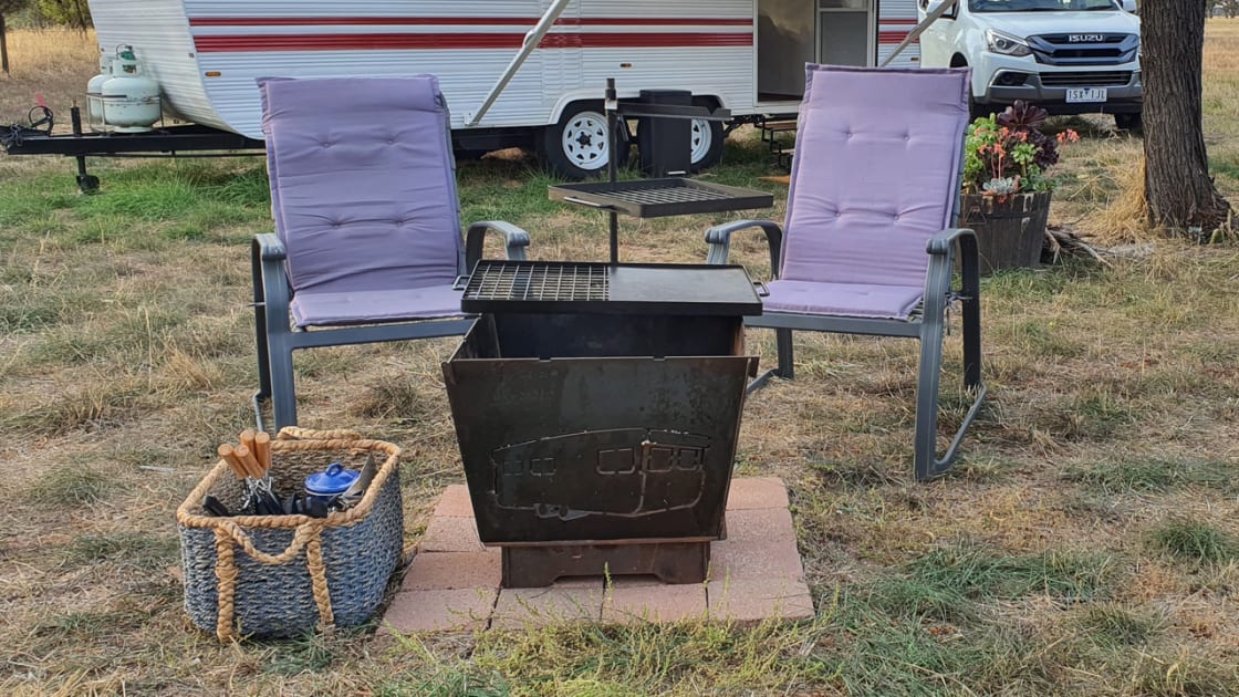 Firepit with chairs and camp cook it