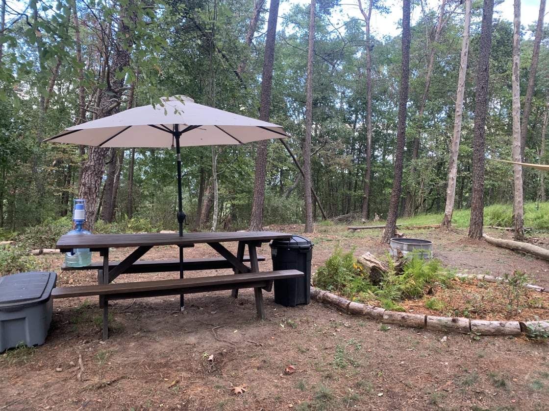 5 gallon jug of fresh spring water waits for you at the huge picnic table with umbrella. 