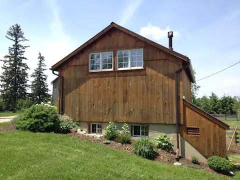 Restored with pine board exterior to give a country feel to The Farm Shed.