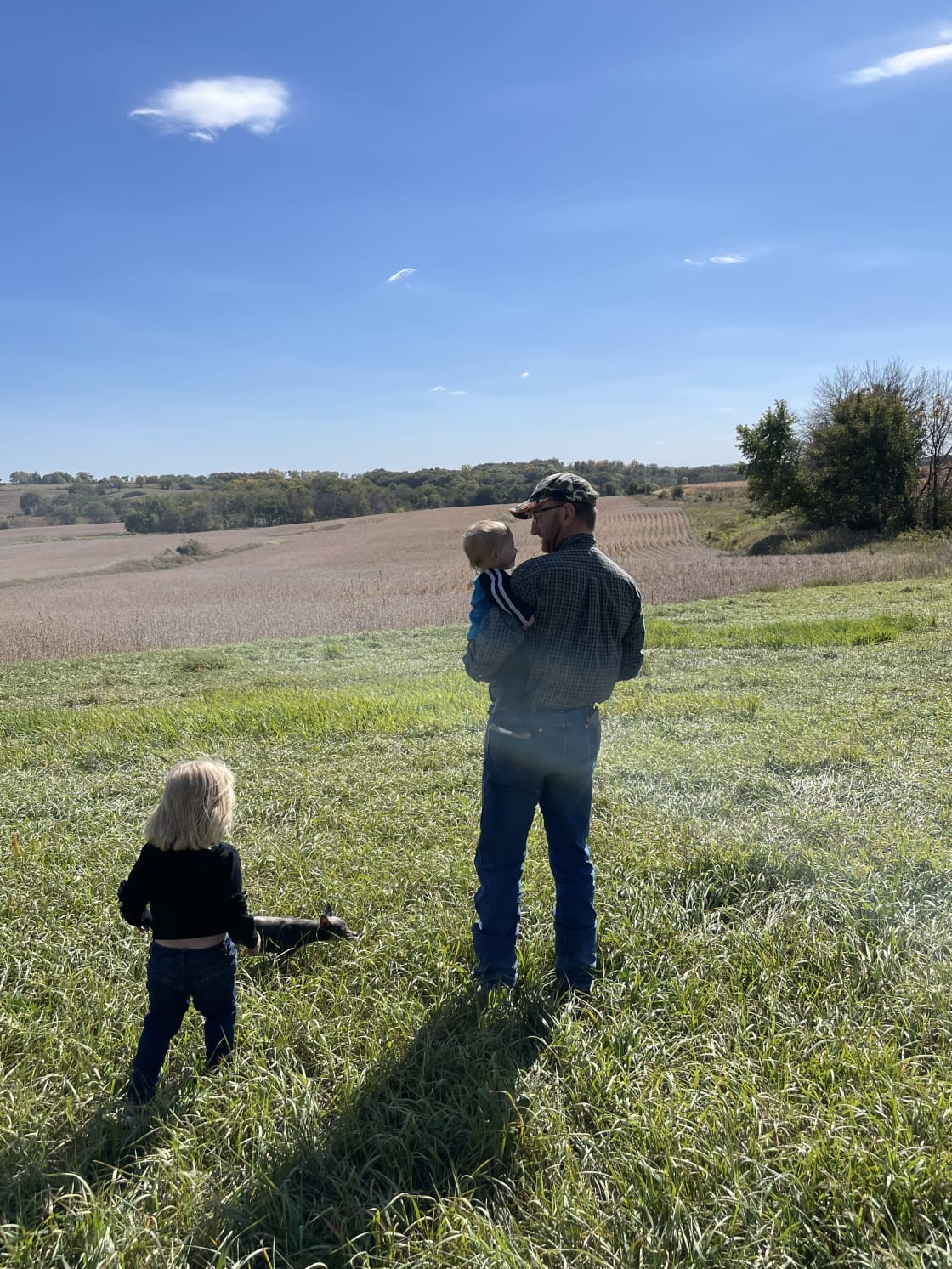 My husband, daughter and grandson checking out the fields