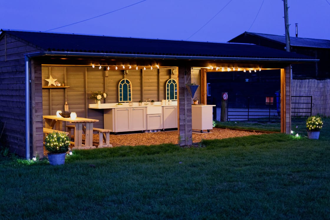Our covered outdoor kitchen area provides everything you could possibly need during your stay. 