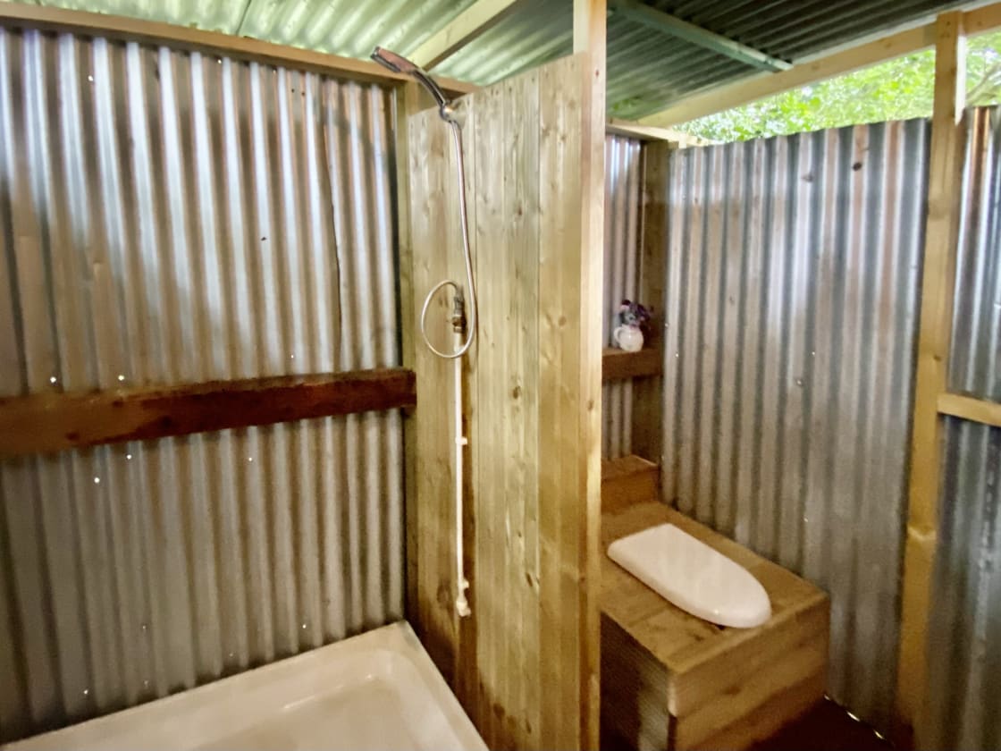 Bathroom is outdoor . Hot shower and compost toilet. 